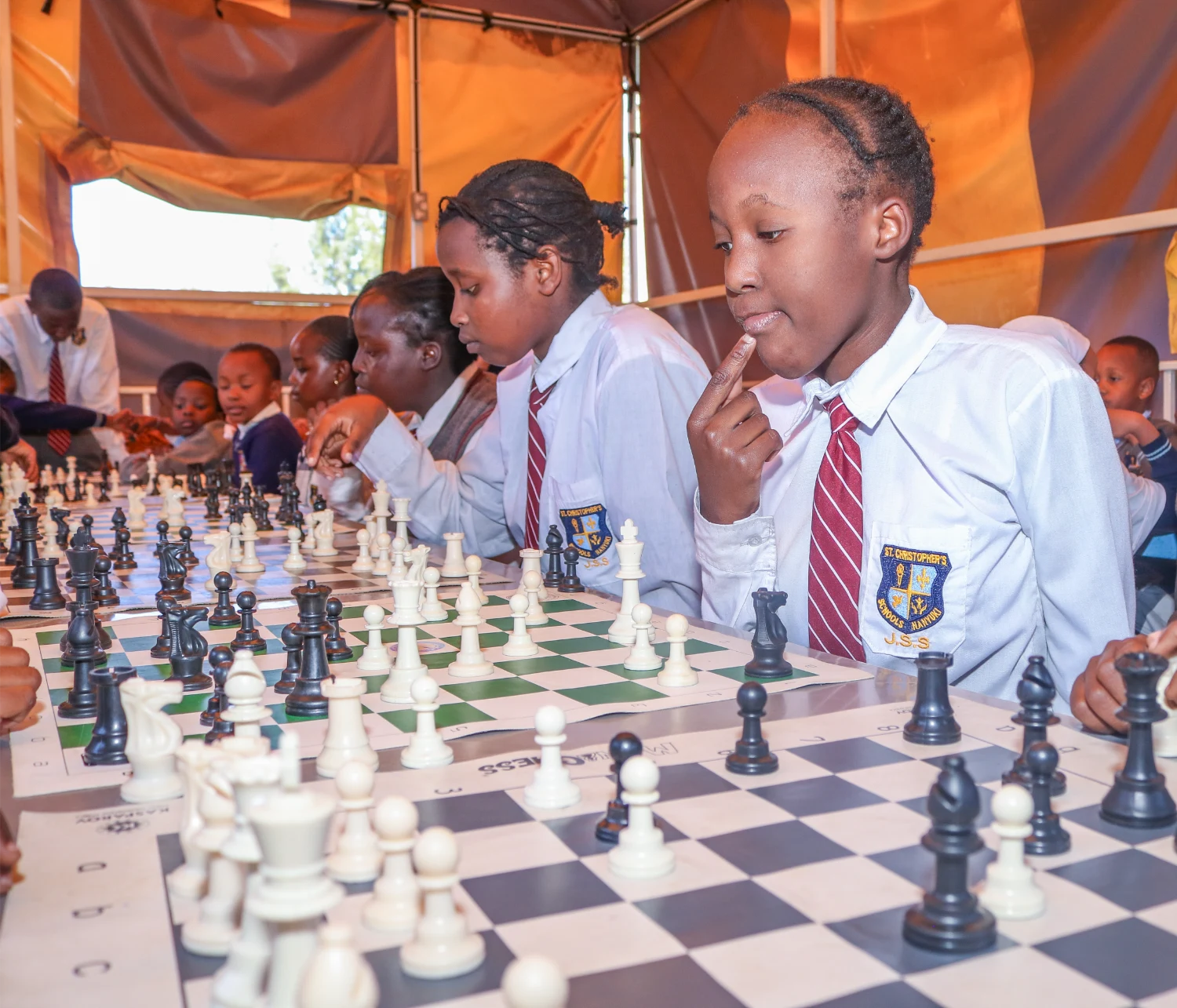 A student thinking through her next chess move