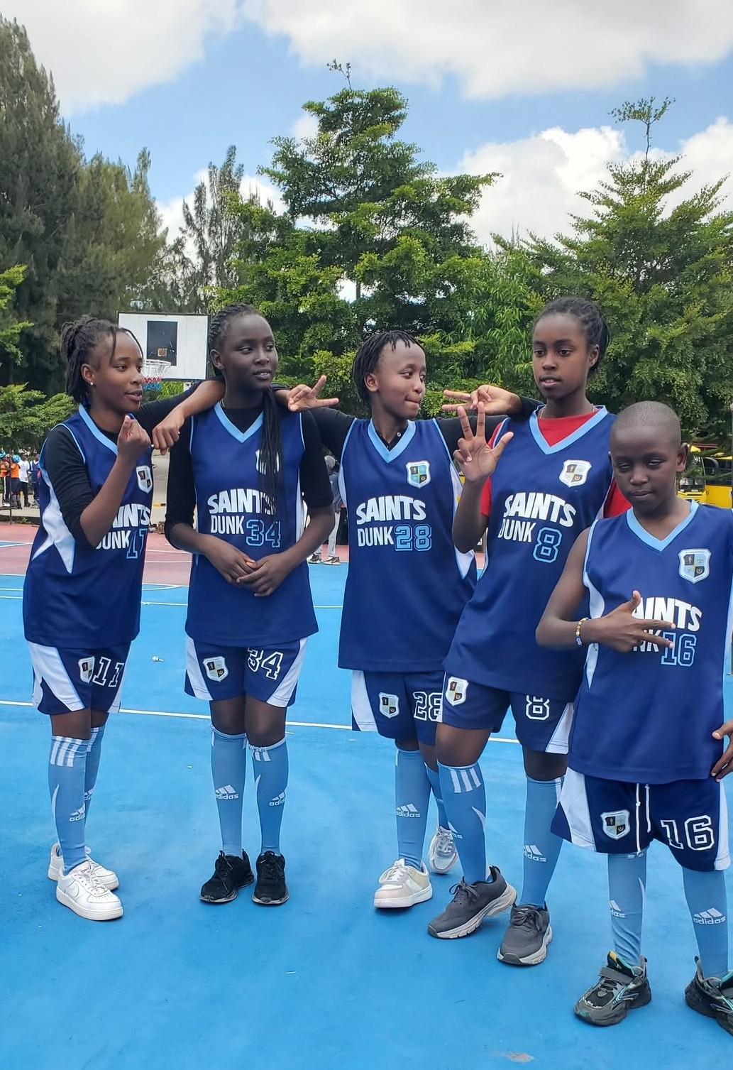 St. Christopher's Saints Dunk girls' basketball team on court at an inter-school tournament