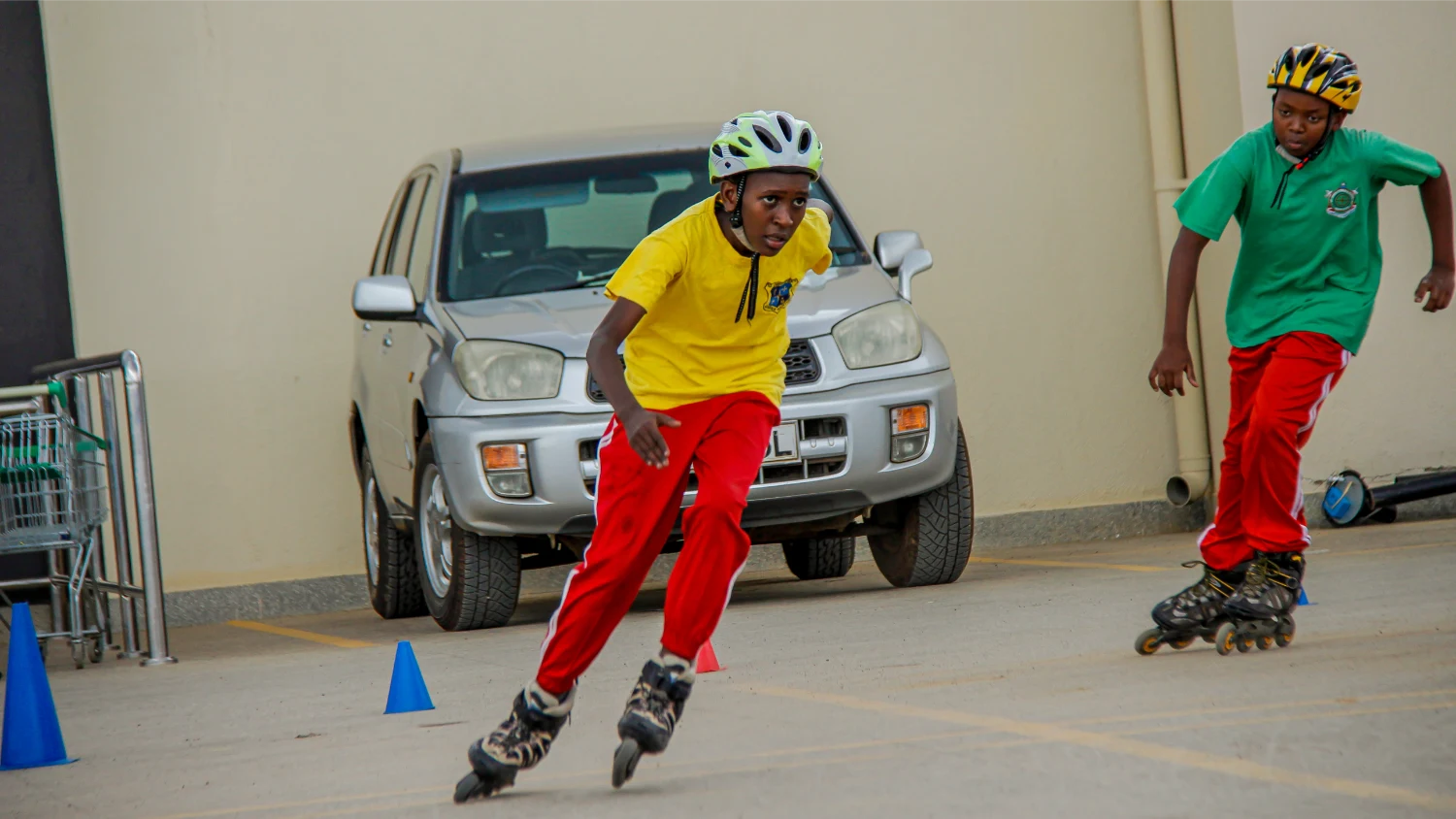 Students inline skating around training cones