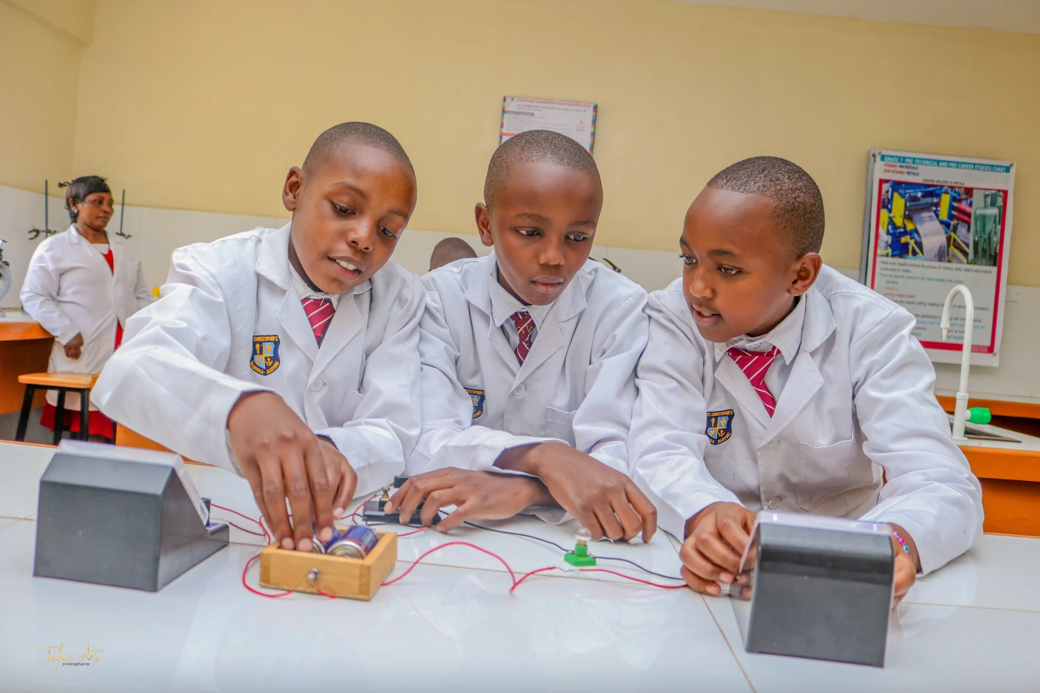 Junior Secondary students doing a circuits experiment in the science lab at St. Christopher's